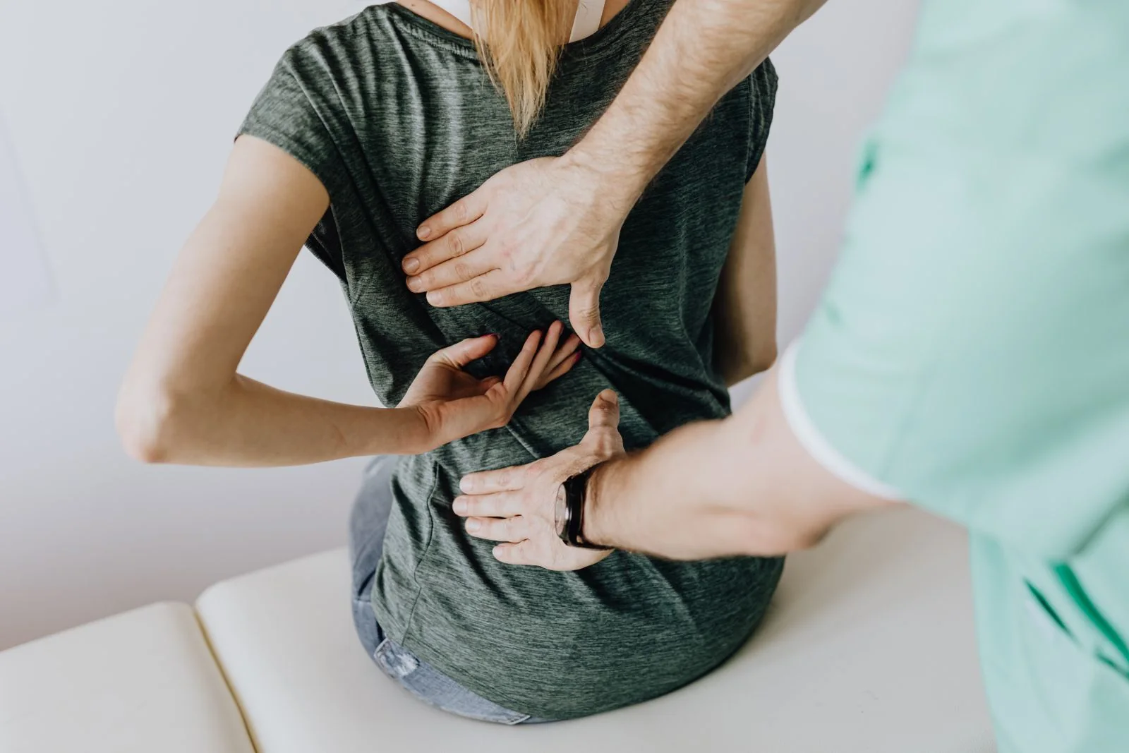 Illustrative physiotherapist supporting a patient during a treatment session
